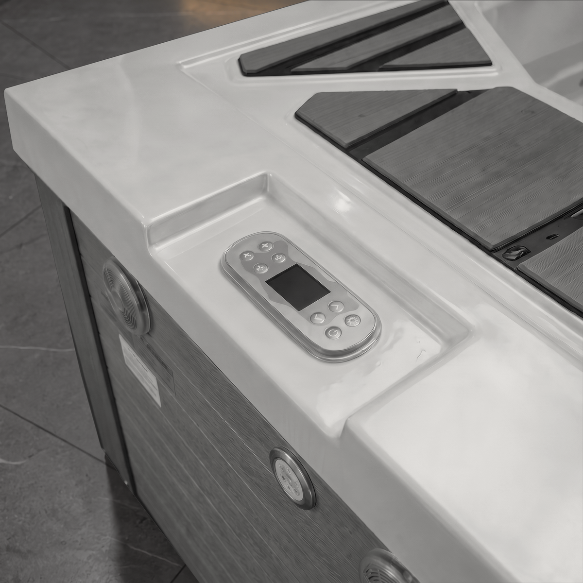 Close-up of a hot tub cold plunge control panel mounted on the white outer shell, with dark wood-look interior slats and tiled flooring visible in the background.