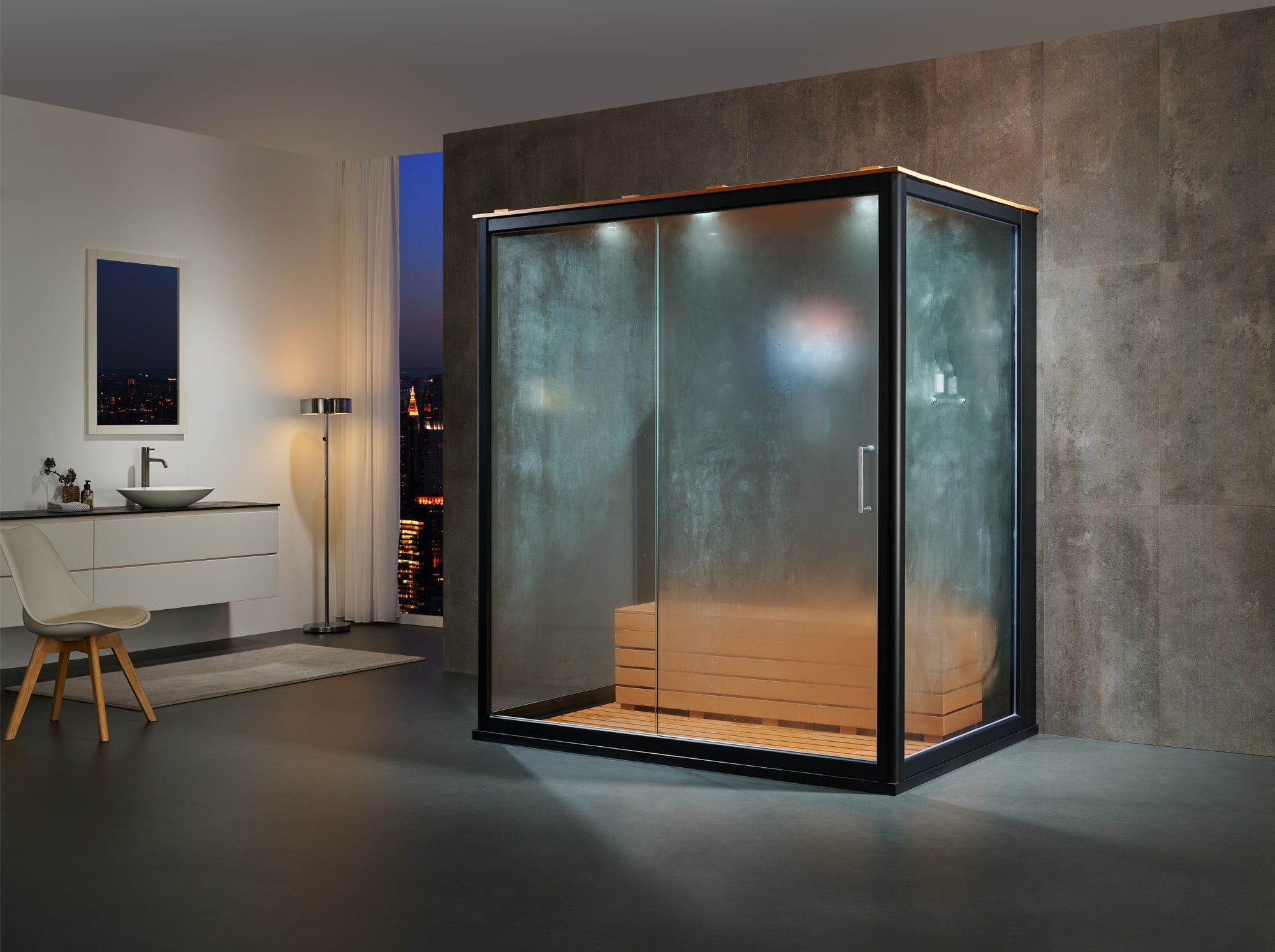 A modern glass steam room or sauna enclosure with a black metal frame and a wooden bench inside, shown in a contemporary bathroom setting with a concrete wall and vanity.