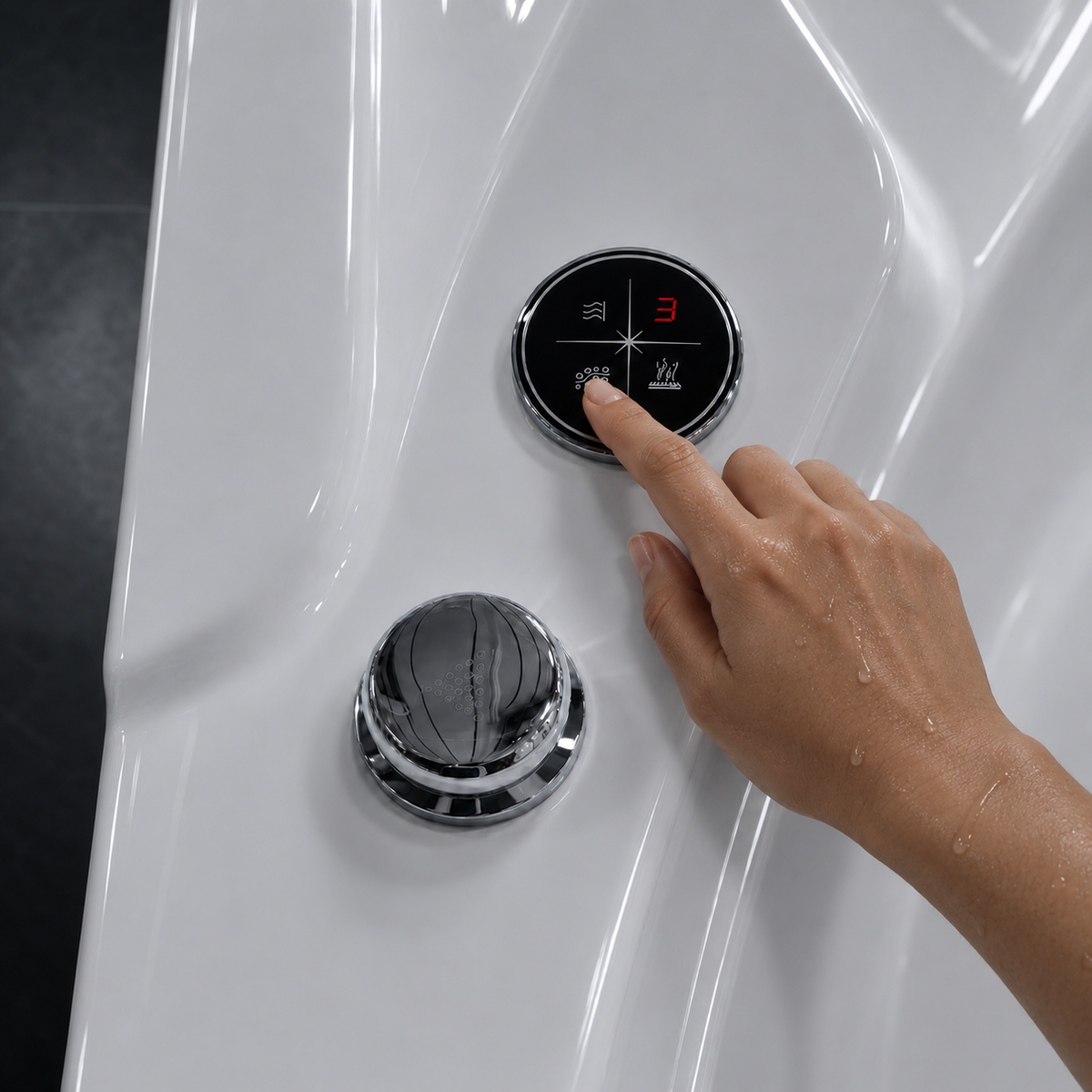 A close-up of a hand pressing a circular digital control button on a glossy white modern shower or bathtub surface, with a chrome pop-up drain below.