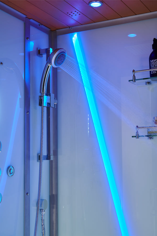 A wall-mounted shower head with water spraying, installed in a modern shower enclosure with bright blue LED lighting and a wood-look ceiling.