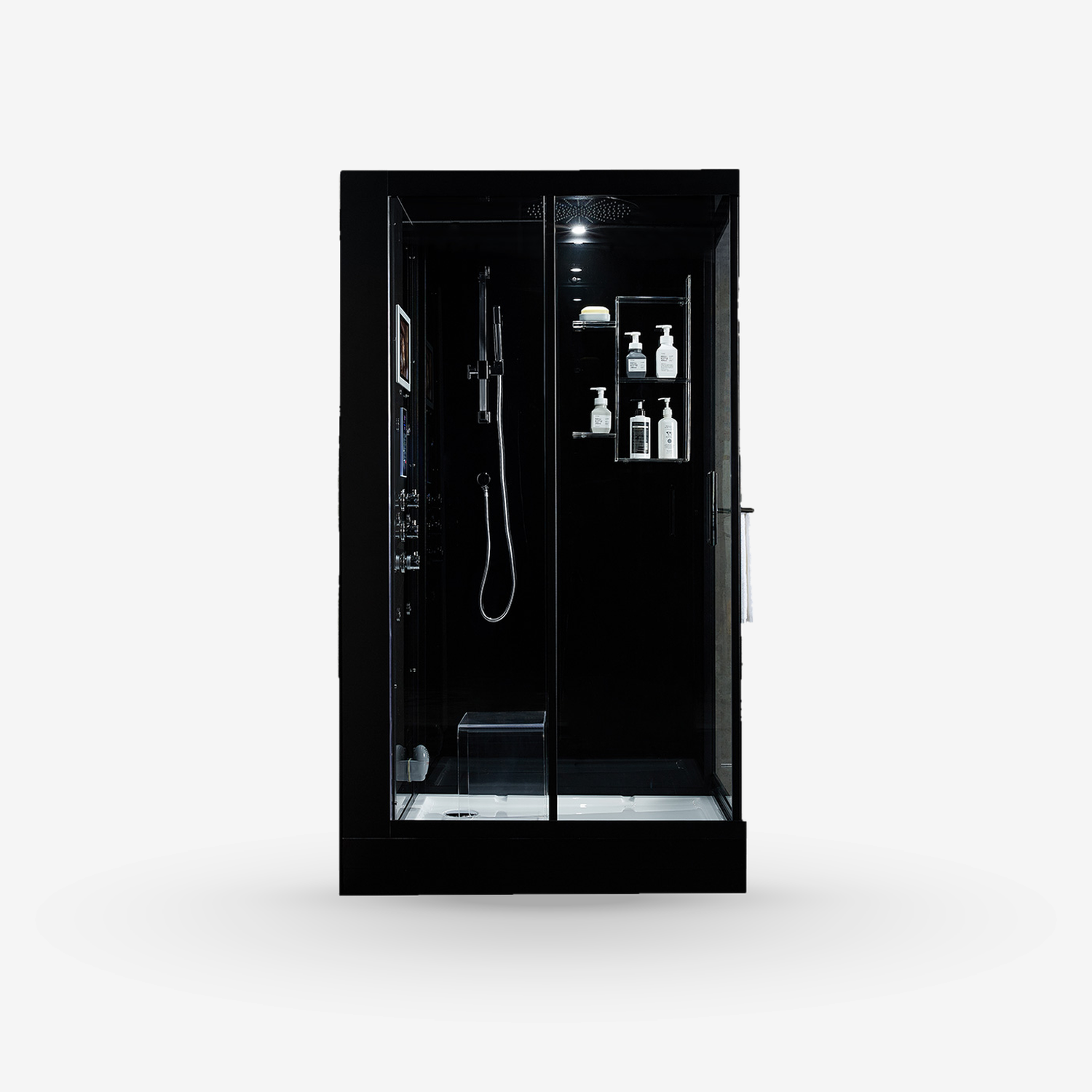A modern black walk-in steam shower cabin with glass doors, featuring an integrated shower head, handheld shower, built-in shelves with toiletry bottles, and a floor-mounted control panel, shown against a plain light gray background.