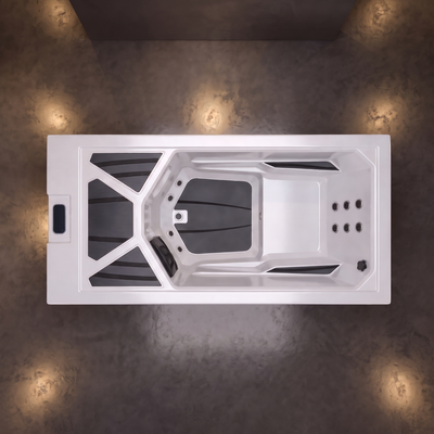 A top-down view of a white outdoor hot tub cold plunge with gray liner sections, set on a wooden deck with dappled sunlight and shadows.