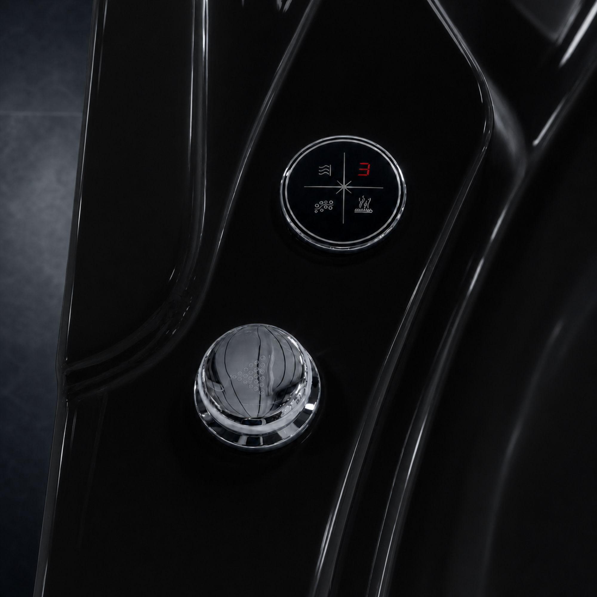 Close-up of a glossy black car interior showing a circular control panel with mode icons and a chrome button below it.